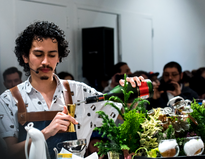 Remy Molina pours a drink at the New York Coffee Festival 2018.